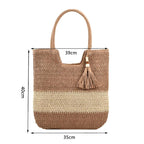 Woven handbag with tassel and measurements on a white background