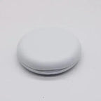 Round white object on a light gray background