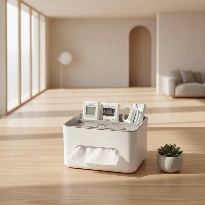 White desk organizer with electronic devices, glasses, and a plant on a wooden surface.