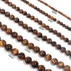 Beaded strands of tiger eye beads with measurements indicated on a white background