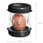 Black egg holder with a brown egg inside, showing dimensions on a white background