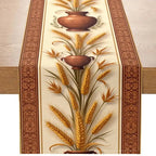 A table runner with a rustic design, featuring golden wheat stalks and brown ceramic vases on a cream background, bordered by brown patterns on the sides, displayed on a wooden table.
