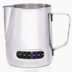 Stainless steel milk pitcher with temperature gauge on a white background