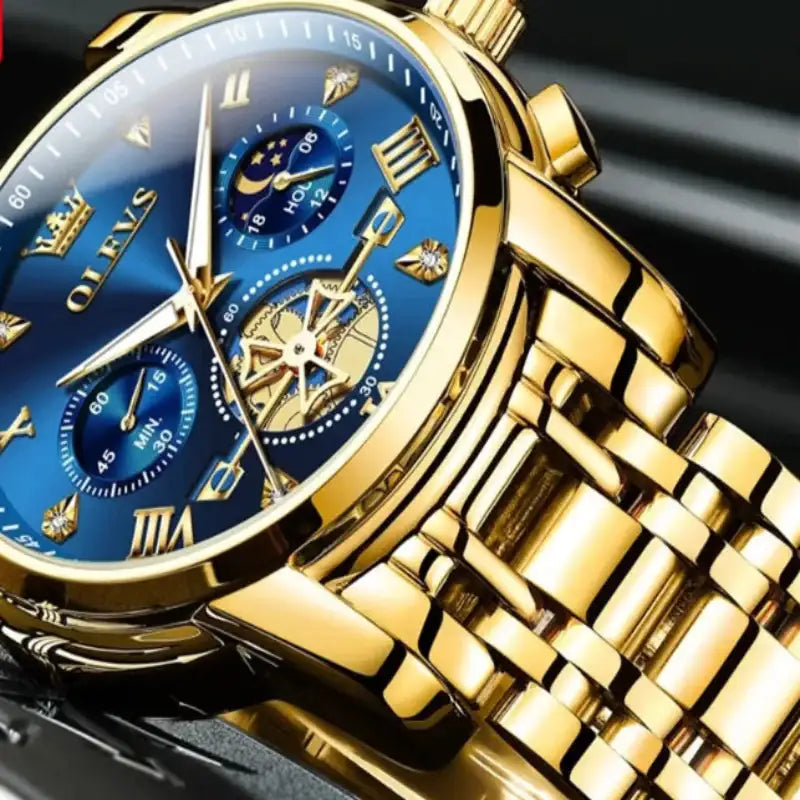 Gold wristwatch with blue face on a black background, featuring the OLEVS brand.