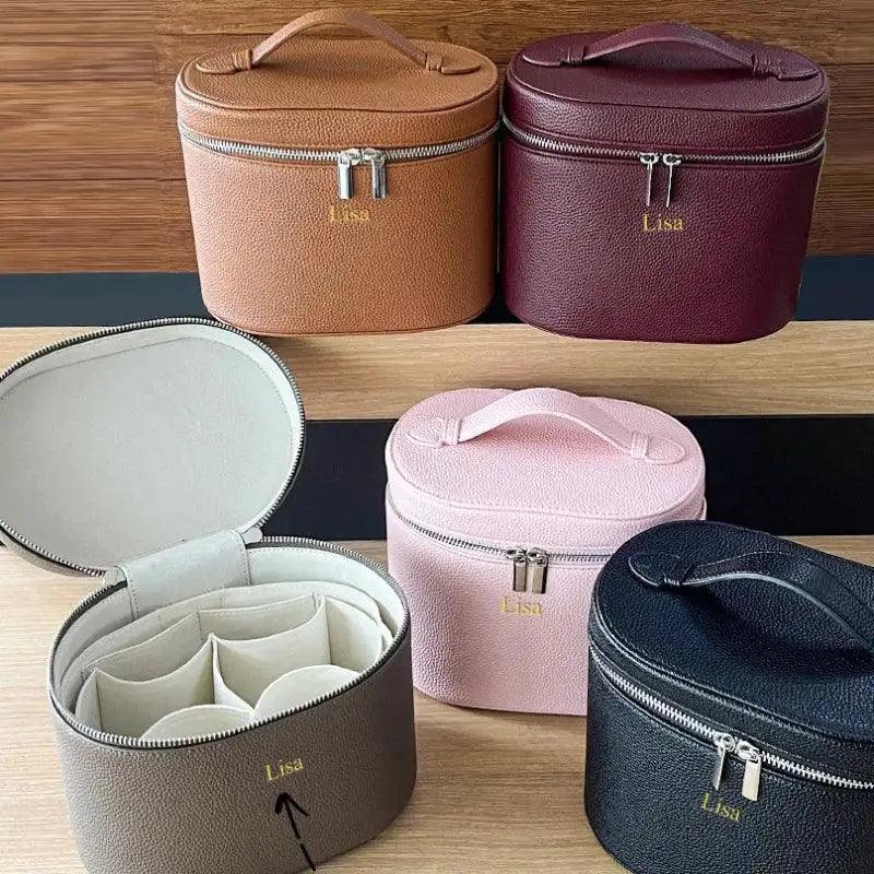 Set of customizable cosmetic bags in various colors on a wooden surface.