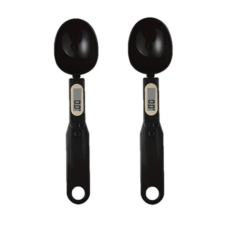Two black digital measuring spoons on a white background