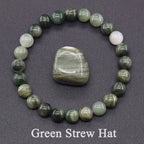 Beaded bracelet with a central stone on a gray background, labeled 'Green Strew Hat'.