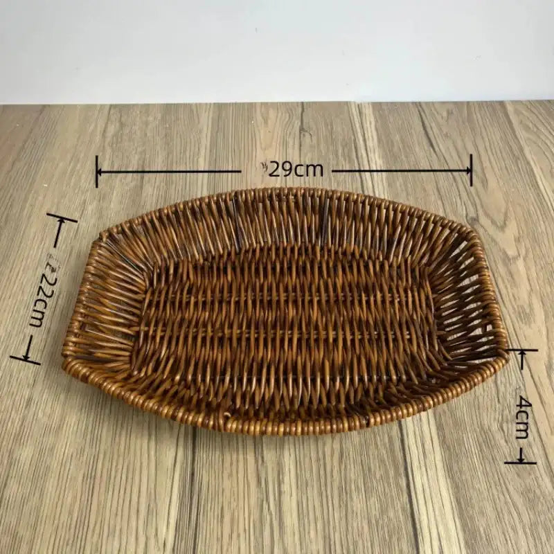 Wicker bread basket with dimensions on a wooden surface