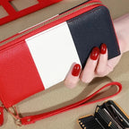 Red and black wallet with a hand holding it, showing details of card slots and compartments.
