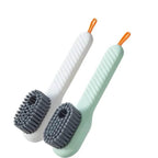 Two cleaning brushes with gray bristles on white background