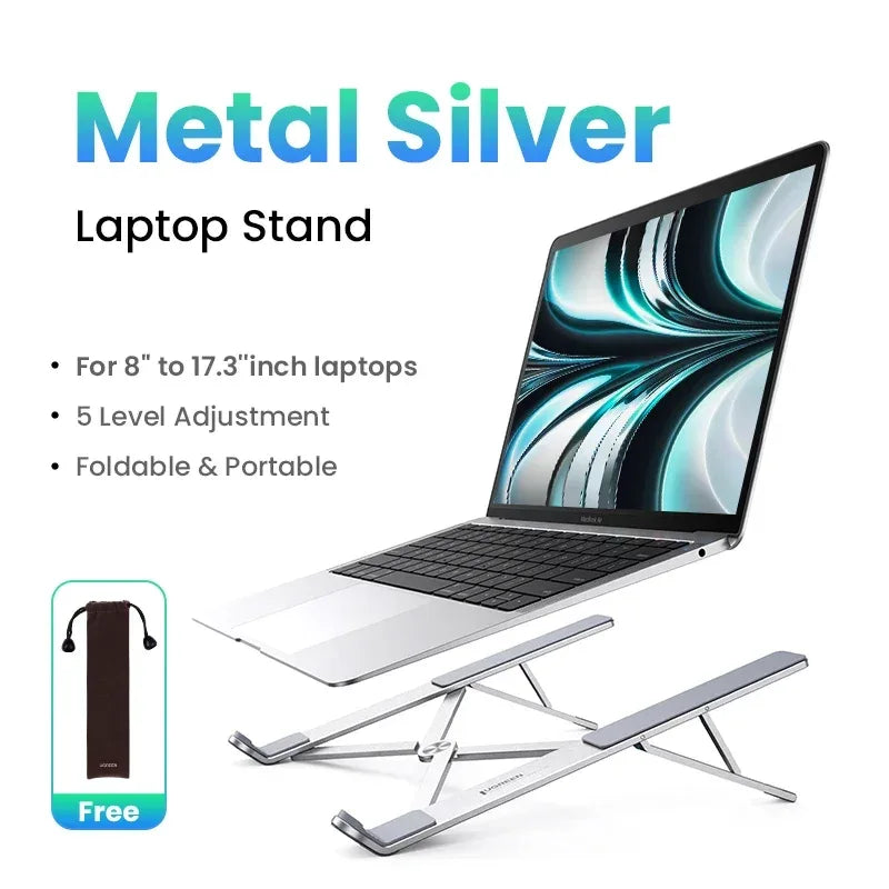 Metallic silver laptop stand with laptop on a white background