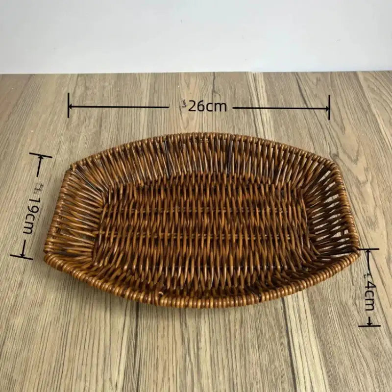 Wicker bread basket with dimensions on a wooden surface