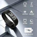Black digital wristband fitness tracker shown on a gray tiled surface with feature icons for time, step, mileage, calorie, alarm, sleep, and large battery capacity.