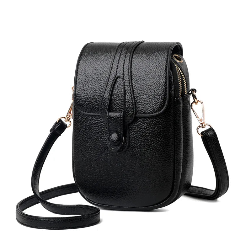 Black leather crossbody bag on a white background
