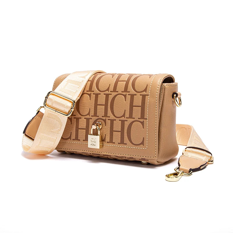 Beige handbag with gold strap and 'CHC' branding on a white background