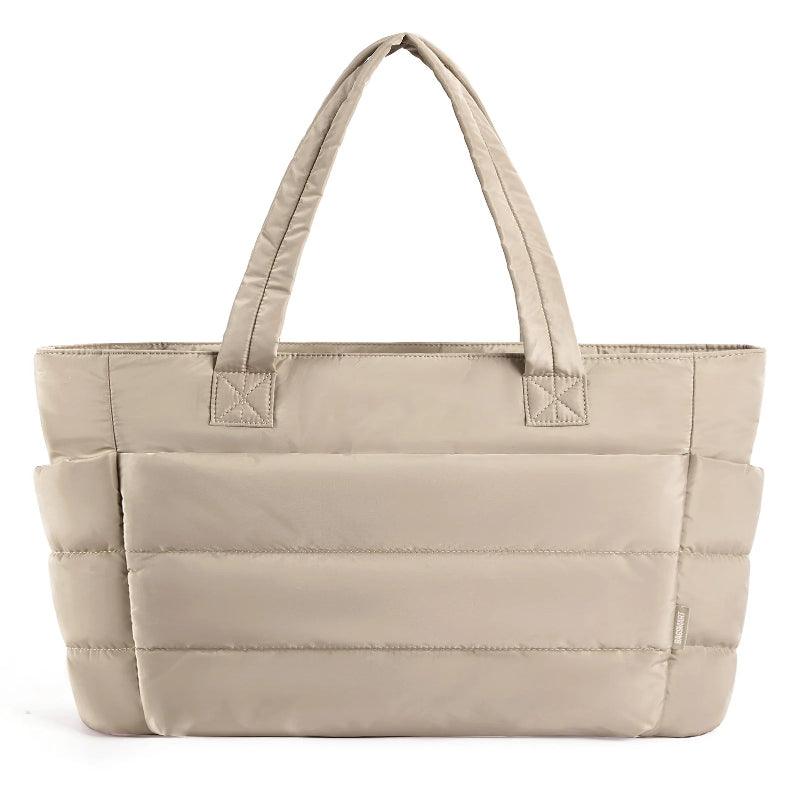 Beige tote bag with quilted design on a white background