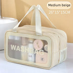 Beige wash bag with transparent side panel on a light background