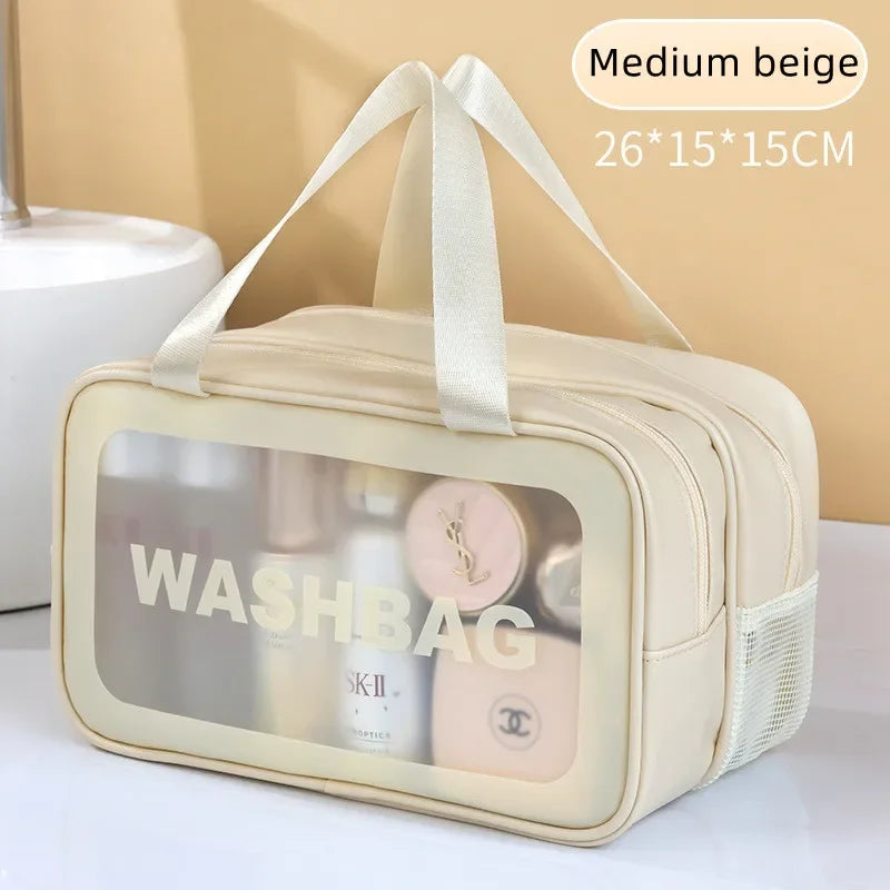 Beige wash bag with transparent side panel on a light background