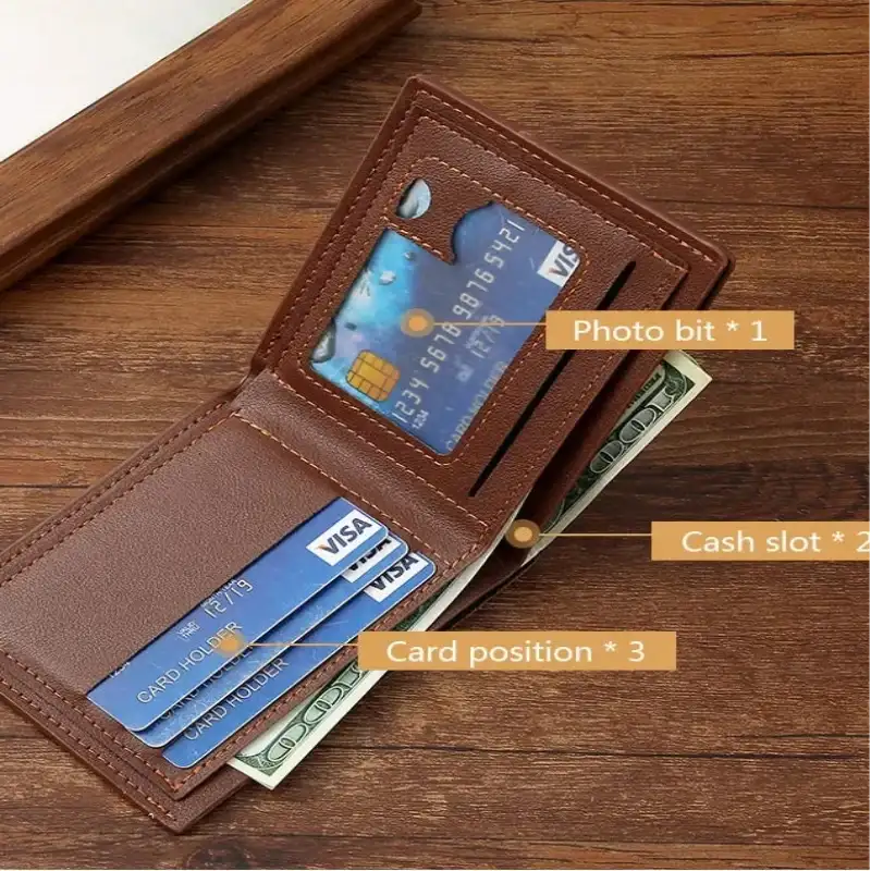 Brown leather wallet with card slots and cash pocket on a wooden surface
