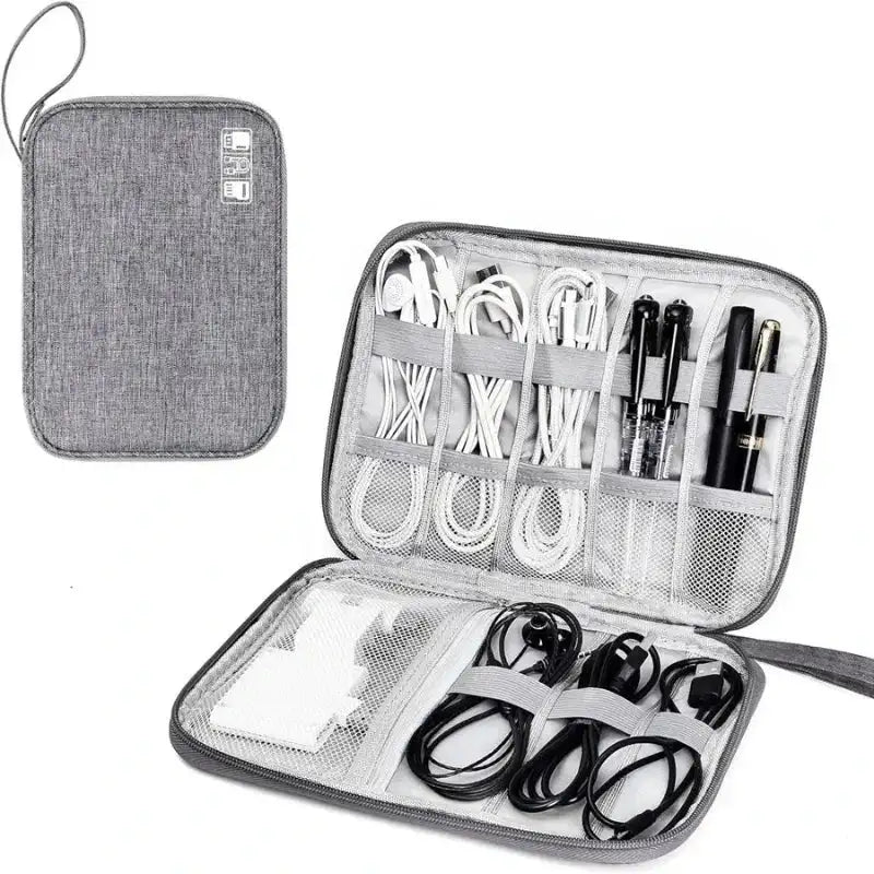 Gray travel organizer with compartments for electronic cables and devices on a white background