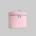 Pink cosmetic bag with a handle on a white background