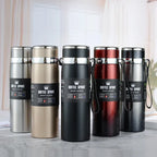 Set of five insulated bottles with visible branding on a neutral background