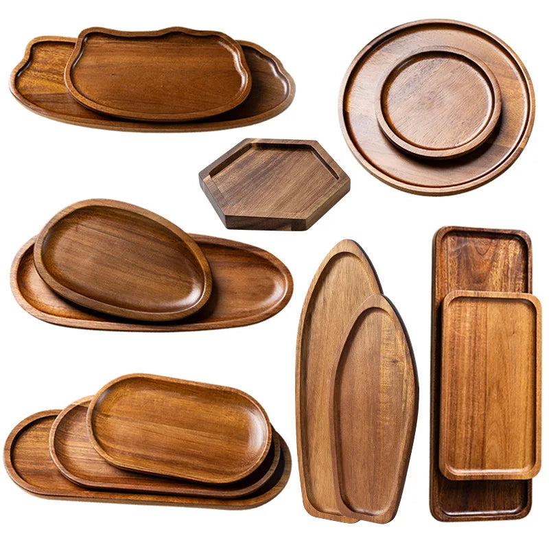Collection of wooden trays in various shapes and sizes on a white background