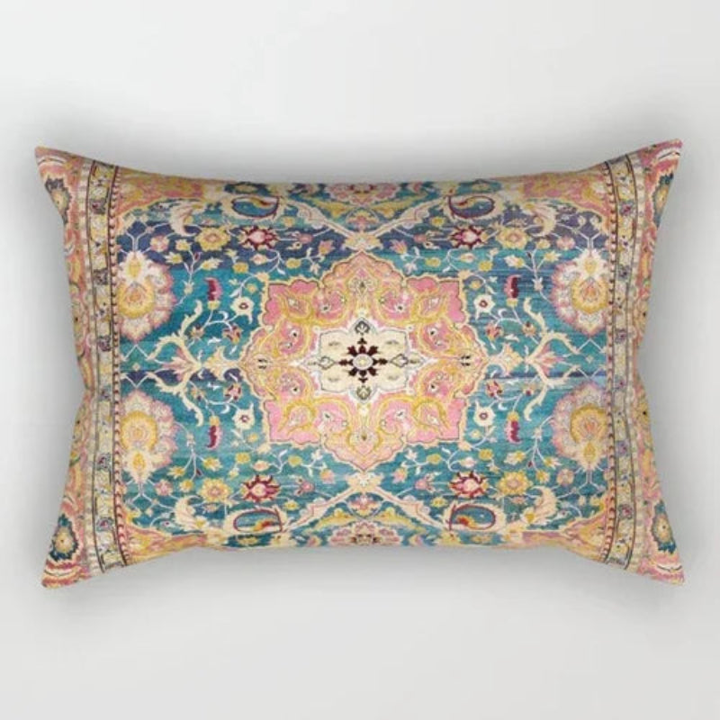 Decorative pillow with intricate floral pattern on a white background
