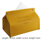Yellow tissue holder with 'Enjoy your life, sunshine, happiness' text on a white background