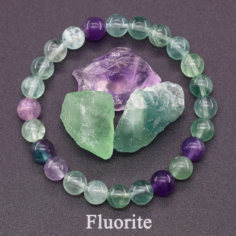 Fluorite bracelet with raw fluorite crystals on a dark background
