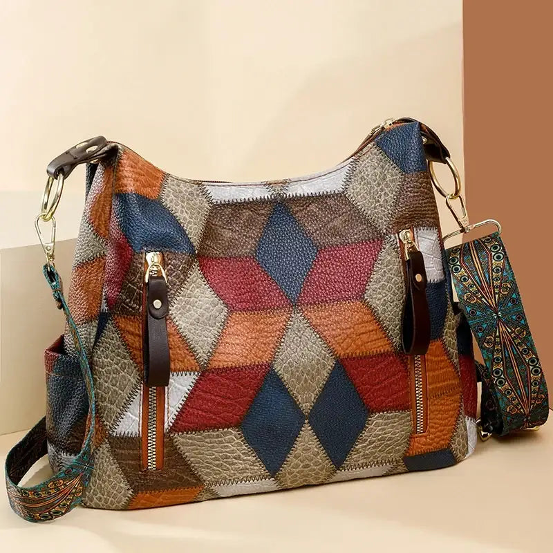 Multicolored patchwork handbag with a strap on a beige background
