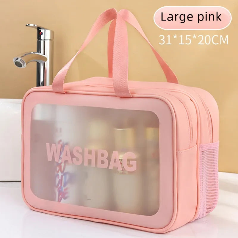 Pink washbag with transparent window on a bathroom counter