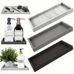 Set of gray and black trays with bathroom items on a white background