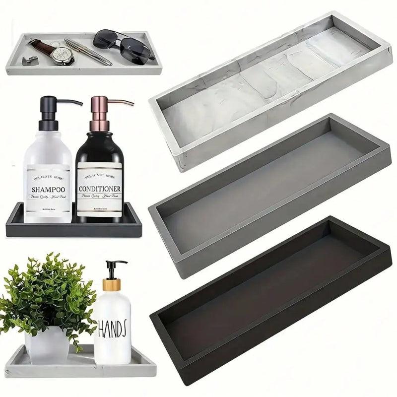 Set of gray and black trays with bathroom items on a white background