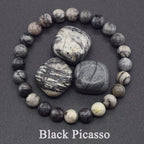 Black Picasso stone bracelet on a dark background with 'Black Picasso' text.