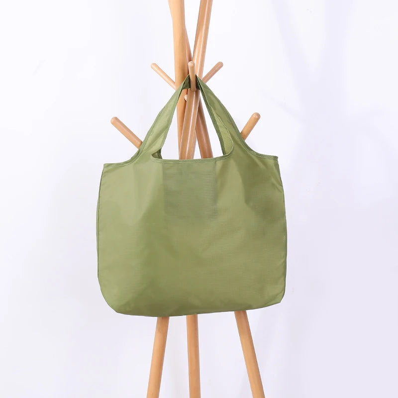 Green tote bag on a white background