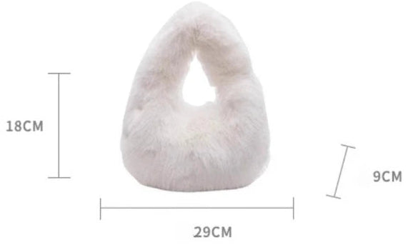 Product dimensions diagram for a white fuzzy crescent-shaped pillow, showing a 1-3cm measurement error and listing fabric, weight, and size details on a light gray background.