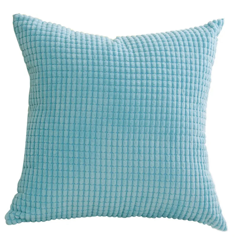 Textured blue pillow on a white background