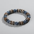 Beaded bracelet with 'Self-Love' text on a wooden surface