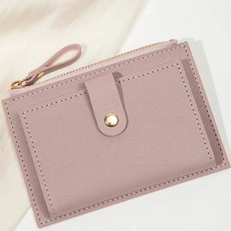 Lilac purple wallet with a strap on a light background
