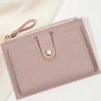 Lilac purple wallet with a strap on a light background