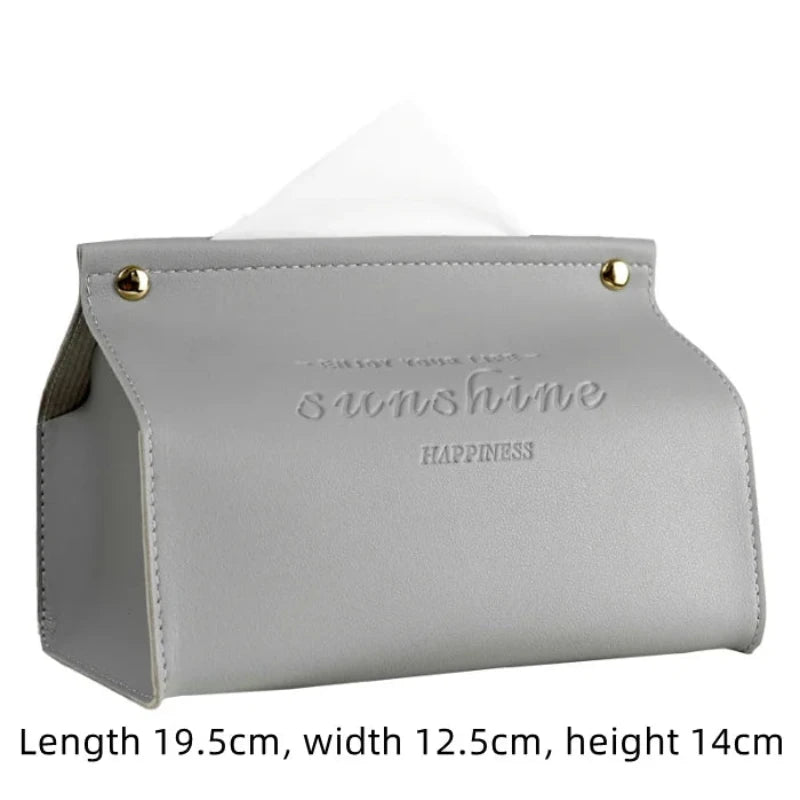Gray tissue holder with 'sunshine happiness' text on a white background