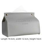 Gray tissue holder with 'sunshine happiness' text on a white background