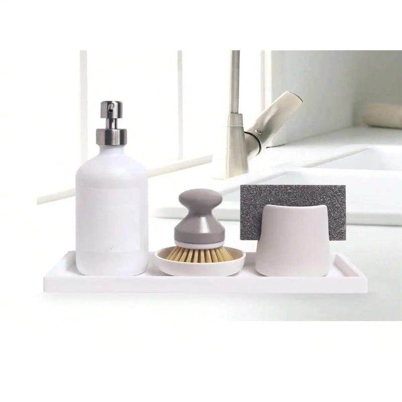 Kitchen sink area with various utensils and a faucet.