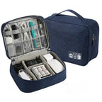 Blue travel organizer with electronic devices inside on a white background
