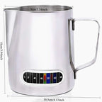 Stainless steel milk frothing pitcher with temperature gauge and dimensions on a white background
