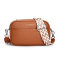 Brown leather crossbody bag with a patterned strap on a white background