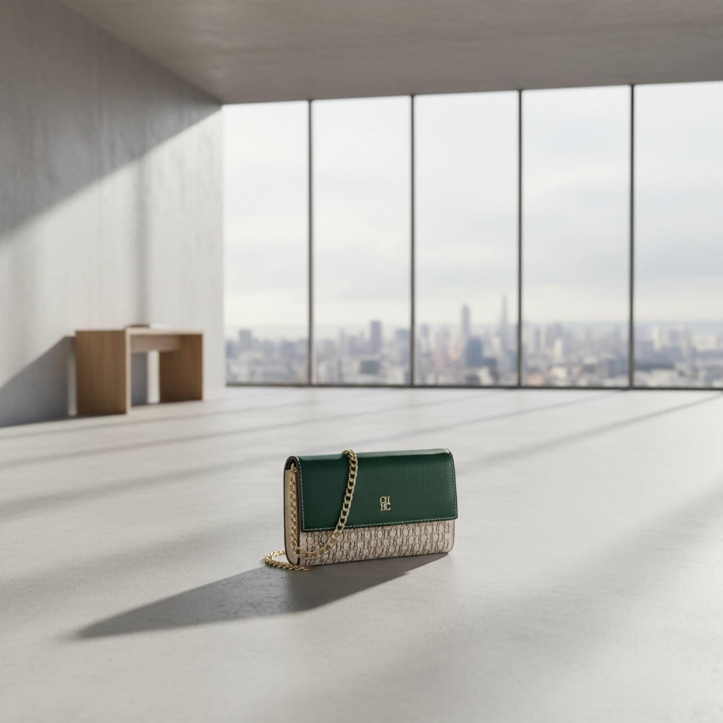 Green handbag with gold chain strap on a white background
