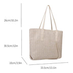 Beige woven tote bag with measurements on a white background