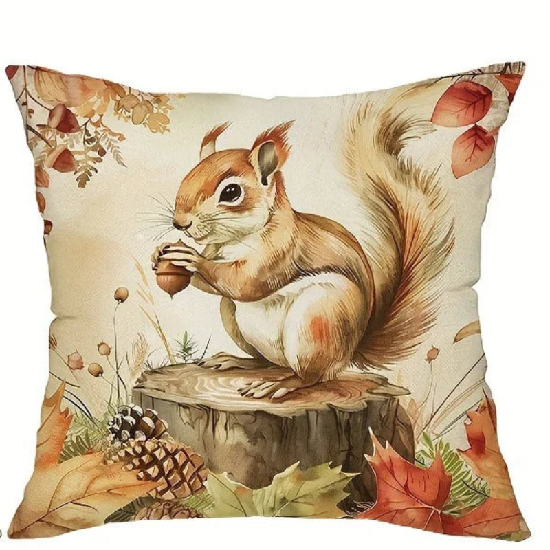 Decorative pillow with a squirrel and autumn leaves design on a beige background